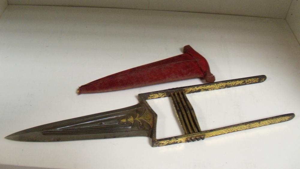 Lot 718 - A 19th century Indian katar push dagger in red velvet scabbard