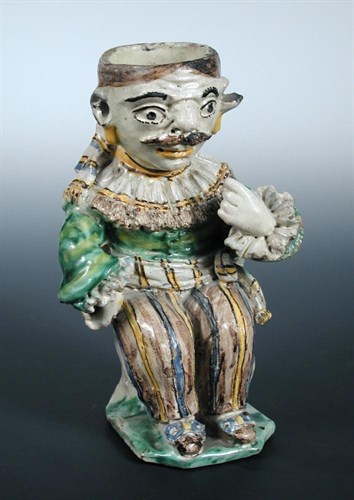 Lot 53 - An 18th century Cerreto Sannita maiolica figural oil lamp