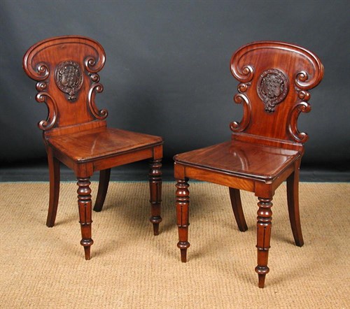 Lot 918 - A pair of Victorian mahogany hall chairs