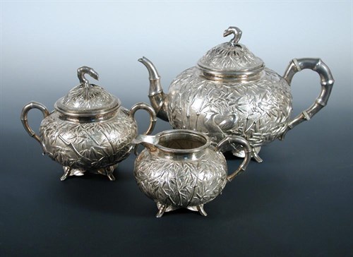 Lot 291 - A late 19th/early 20th century Chinese silver three piece tea set