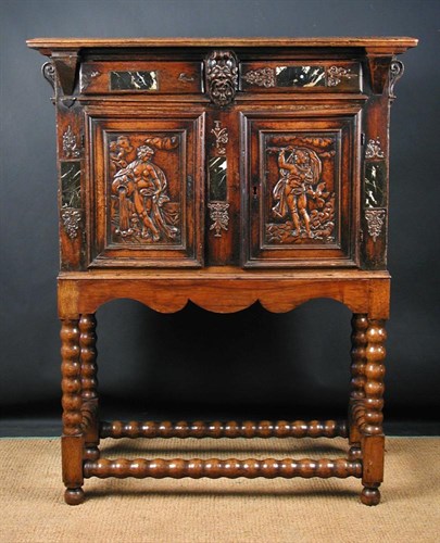 Lot 798 - A late 16th /early 17th century German walnut cabinet on later stand