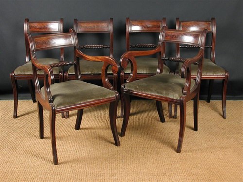 Lot 879 - A set of eight early 19th century mahogany bar back dining chairs, including two carvers