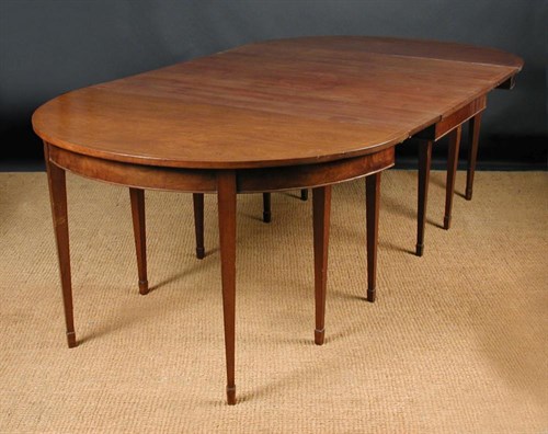 Lot 880 - A George IV mahogany D end dining table