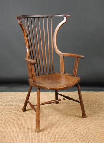 Lot 801 - A late 19th Century ash and elm stick back elbow chair