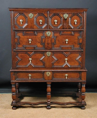 Lot 804 - A 17th century oak chest on stand, circa 1700