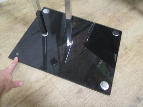Lot 399 - After Eileen Gray, a chrome and glass occasional table