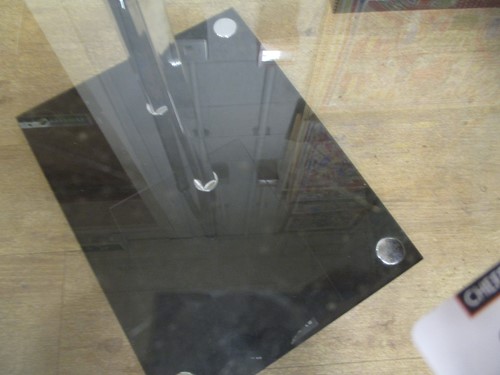 Lot 399 - After Eileen Gray, a chrome and glass occasional table