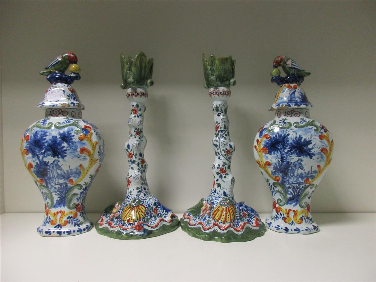 Lot 3 - A pair of polychrome Delft candlesticks and a