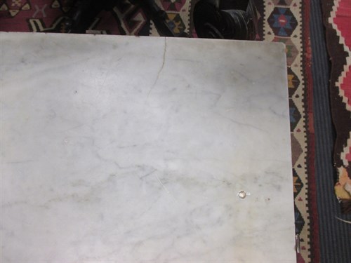 Lot 607 - A pair of marble and ironwork terrace tables in the style of Gilbert Poillerat, 42 x 80 x 40cm. (2)