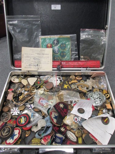 Lot 64 - A collection of military and other badges, a...