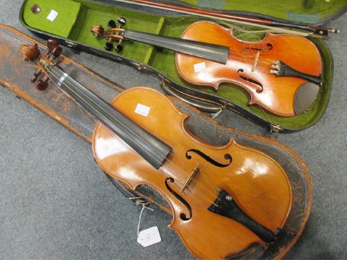 Lot 247 - An early 20th century violin with a one piece back and scroll head, together with bow and case