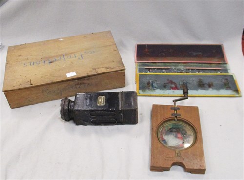 Lot 114 - A collection of late 19th/early 20th century Magic Lantern equipment