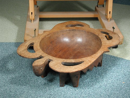 Lot 151 - A carved hardwood tribal bowl