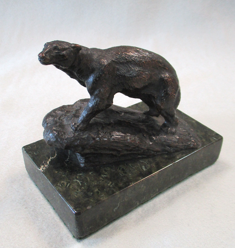 Lot 42 - A bronze model of a Polar bear walking up a...