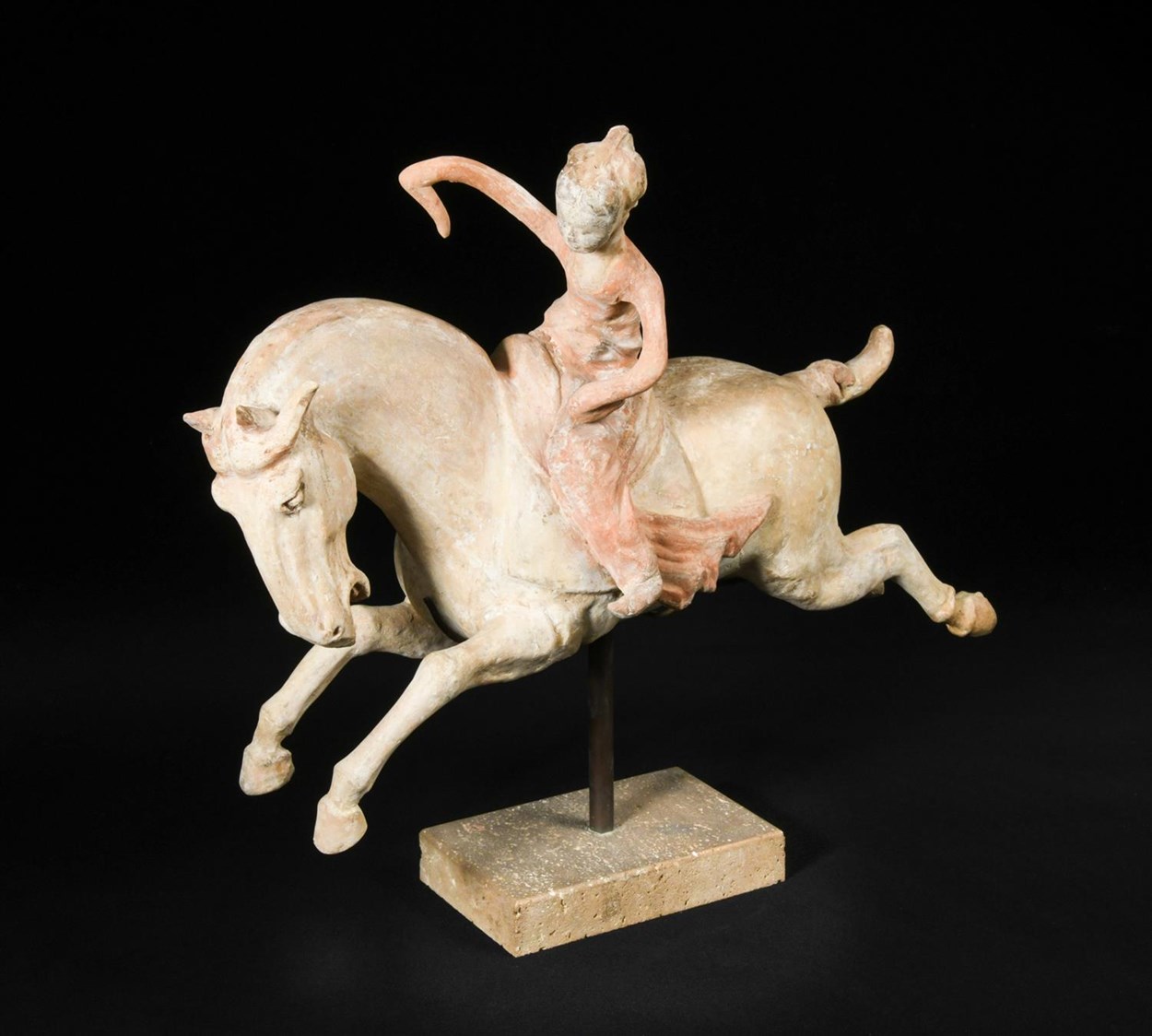 Lot 34 - A red painted Tang dynasty pottery female polo player