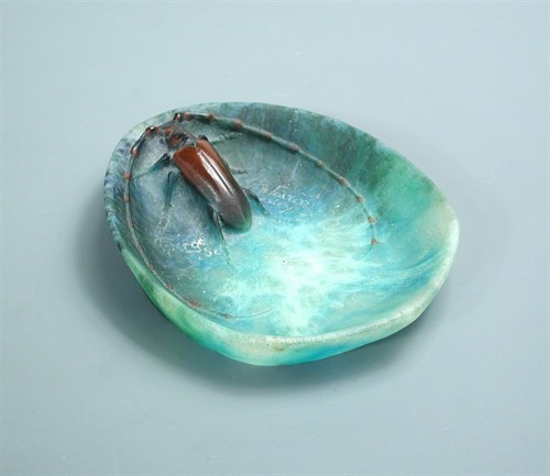 Lot 16 - Amalric Walter (French, 1870–1959) and Henri Berge (French 1870-1937), a pâte-de-Verre glass vide-poche, circa 1920