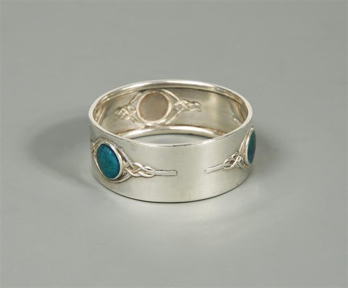 Lot 118 - A silver and enamel napkin ring by William H. Haseler