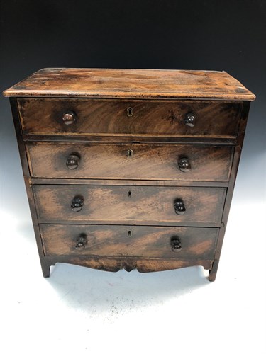 Lot 312 - A late George III mahogany miniature chest of drawers