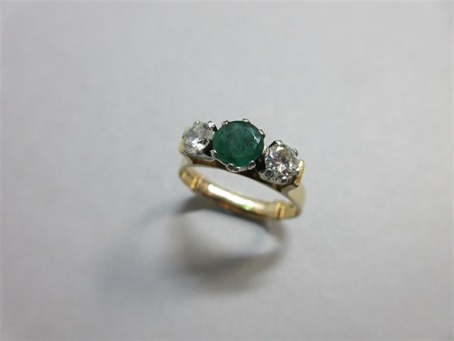 Lot 372 - An emerald and diamond three stone ring set in 18ct gold