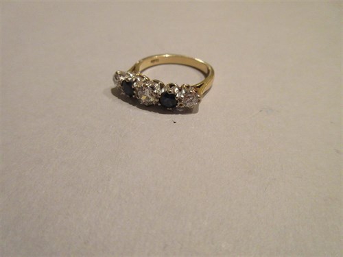 Lot 284 - A diamond and sapphire five stone ring