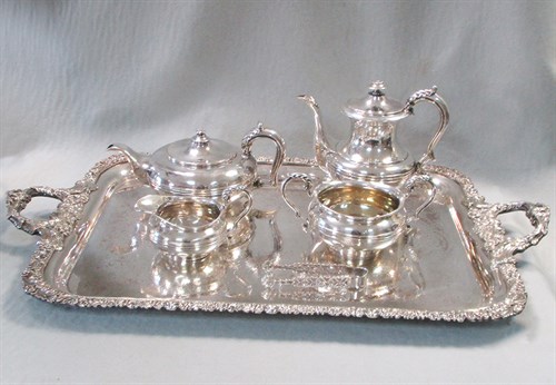 Lot 59 - A George IV silver four piece tea and coffee set and sugar tongs on a silver plated tray