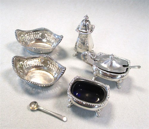 Lot 60 - A 20th century silver three piece condiment set by Garrard & Co and a pair of pin trays