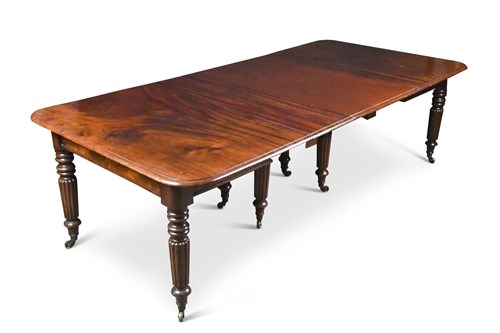 Lot 396 - A late Regency mahogany extending dining table