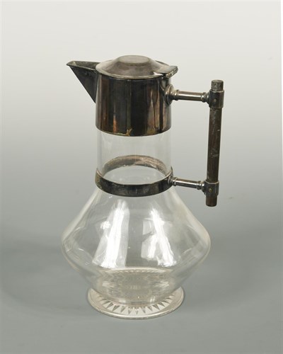 Lot 97 - Attributed to Christopher Dresser, an electroplate and glass claret jug