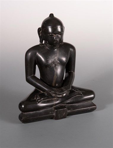 Lot 270 - A late 19th century Jain doleritic black stone Tirthankara
