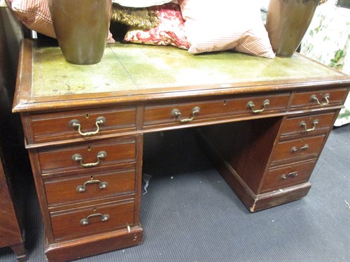 Lot 430 - An Edwardian mahogany pedestal desk with green...