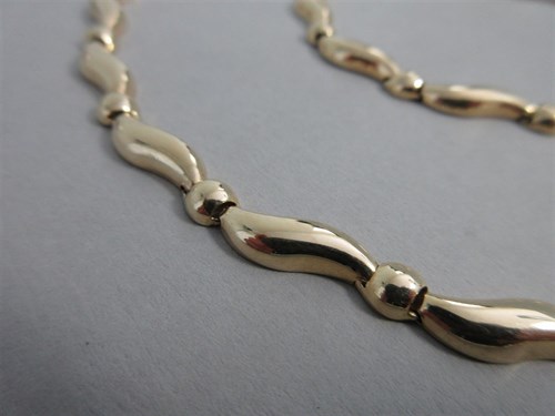Lot 395 - A modern necklace, bracelet and earrings suite by Arpas