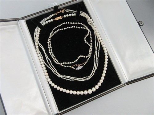 Lot 329 - A row of graduated cultured pearls and two seed pearl necklaces