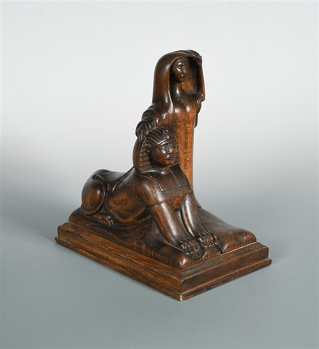 Lot 178 - An early 20th century carved wood lamp base modelled as a lady and a sphinx
