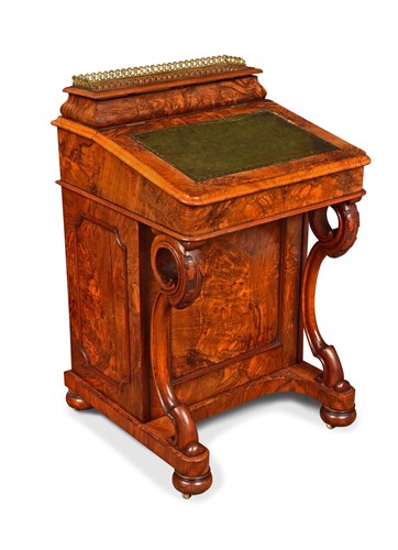 Lot 441 - A mid-Victorian figured walnut Davenport desk