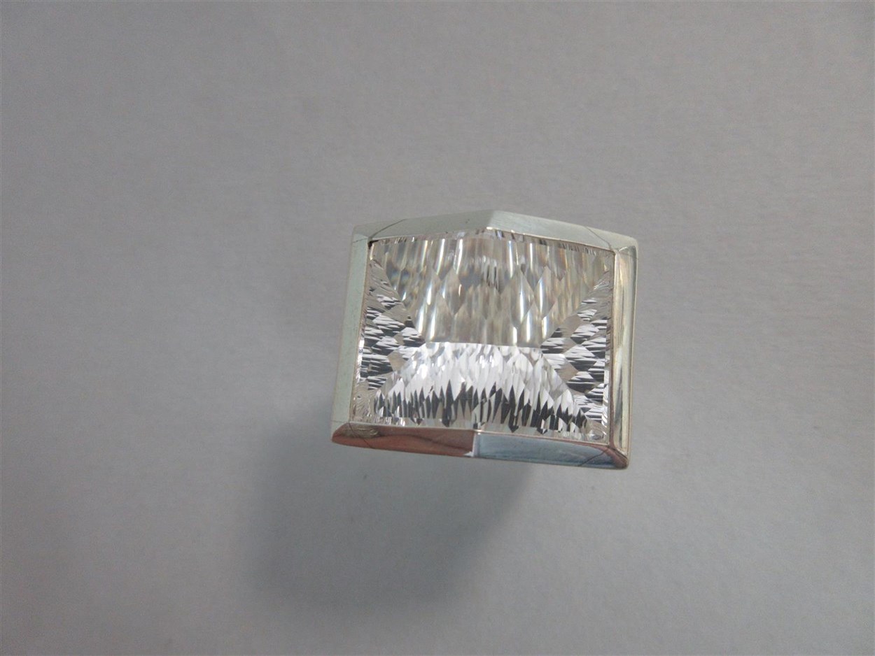 Lot 239 - A futuristic rock crystal 'knuckle duster' ring