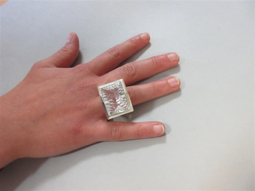 Lot 239 - A futuristic rock crystal 'knuckle duster' ring
