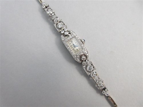 Lot 457 - A diamond set cocktail watch with sapphire set crown circa 1930