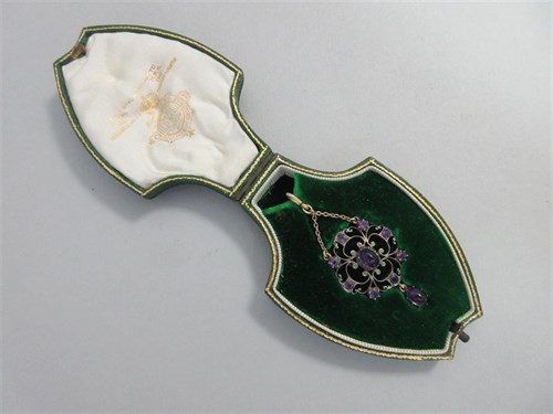 Lot 419 - An amethyst pendant by Child & Child in the original fitted case