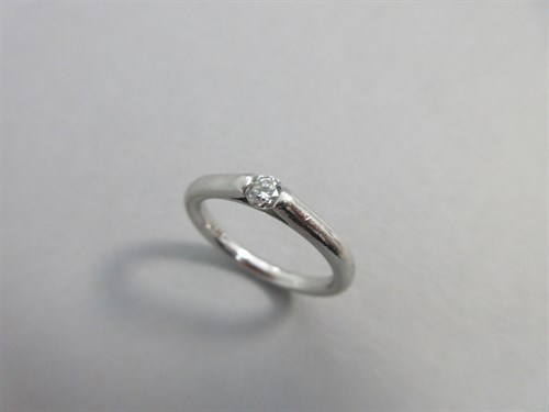 Lot 179 - A platinum and single stone diamond ring by...