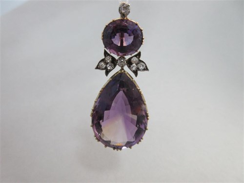 Lot 432 - An antique amethyst and diamond pendant in period leather case