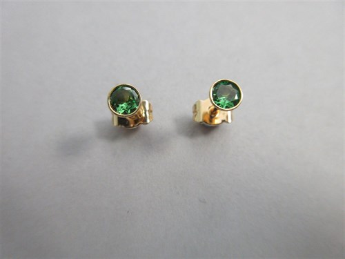 Lot 375 - A pair of tsavorite green garnet earstuds set in 18ct gold