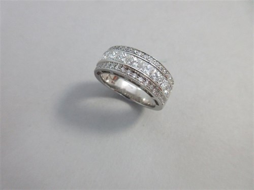 Lot 285 - A three row diamond band ring set in platinum