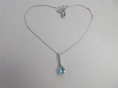 Lot 243 - An aquamarine and diamond pendant set in 18ct white gold with fine link chain