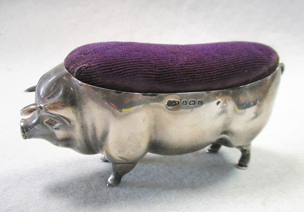 Lot 55 - A litter of four silver pigs