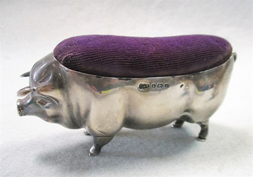 Lot 55 - A litter of four silver pigs