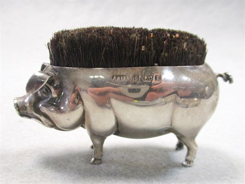 Lot 55 - A litter of four silver pigs