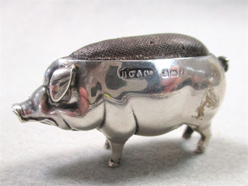 Lot 55 - A litter of four silver pigs