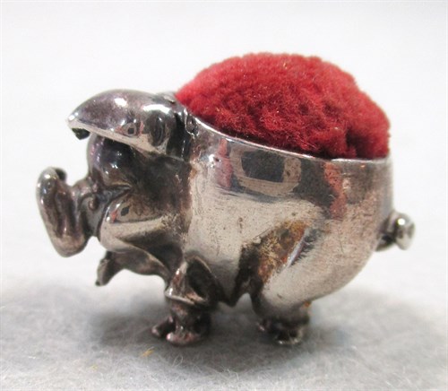 Lot 55 - A litter of four silver pigs