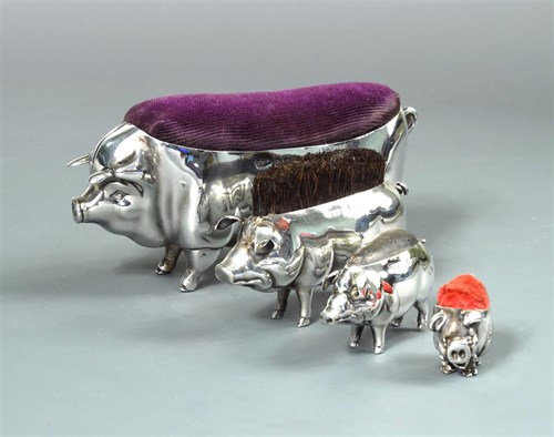 Lot 55 - A litter of four silver pigs