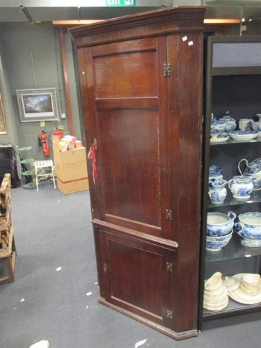 Lot 389 - An 18th century oak standing corner cupboard,...